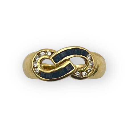 Bague infini or 750 saphirs...