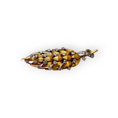 Broche feuille en deux ors...